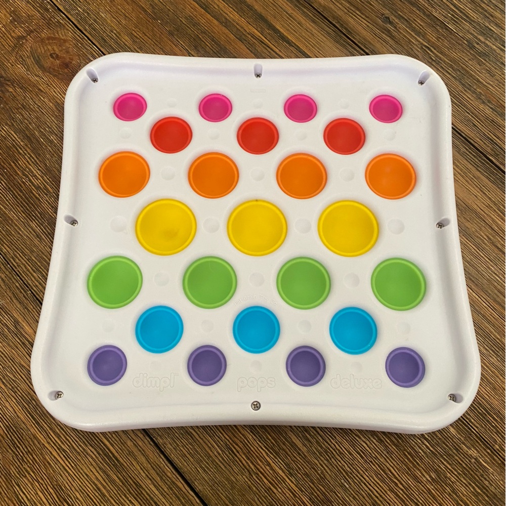 Rainbow colored Dimpl Pops Deluxe Toy